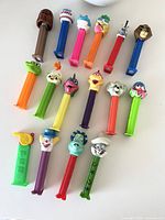 All 16 character Pez dispensers laid out