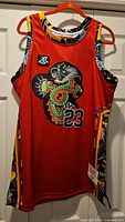 Front view of red Dragon Fly Jones #23 jersey on hanger