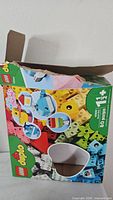Damaged outer box showing Lego Duplo 10909 Heart Box graphics and age/piece count