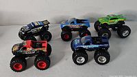All five monster trucks grouped