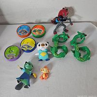 Group shot of all figures and discs