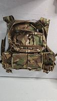Front view showing admin pouch, magazine pouches, buckles and camo pattern