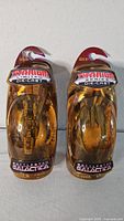 Both sealed Titanium Series Battlestar Galactica die-cast ships in packaging