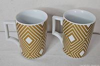 Pair of Starbucks Rosanna mugs front view showing pattern and handles