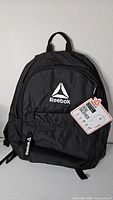 Front view showing Reebok logo, front pocket, hangtag