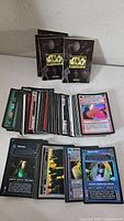 Overall view of cards spread in stacks with two Star Wars rulebook pamphlets