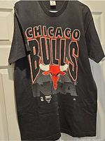 Front view of black Chicago Bulls graphic t-shirt