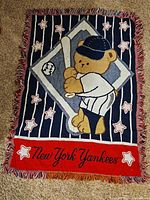 Full view of blanket showing design and fringed edges