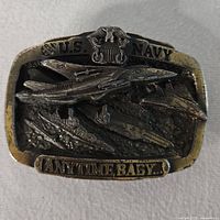 Front view showing jet, carrier, U.S. Navy crest and Anytime Baby motto