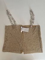 Full front view showing bead mesh body and rhinestone straps