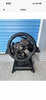Front view of Logitech G923 steering wheel mounted on stand