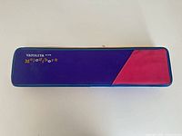 Closed purple and red case marked 'YAOLIYA No.36 Melodihorn'