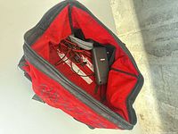 Open Milwaukee tool bag with contents visible