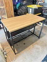 Full view of workstation showing top, frame, shelves