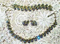 Full view of necklace, bracelet and earrings laid out