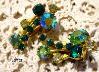 Both clip-on earrings showing rhinestone clusters