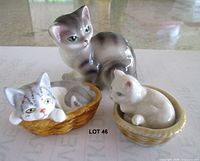 All three cat figurines grouped