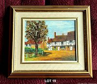 Front view of framed oil painting depicting Tudor village