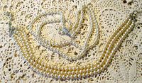 Overall view of both faux pearl necklaces