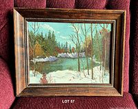 Front view of framed winter landscape painting
