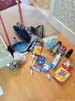 Full view of all cleaning items spread on floor