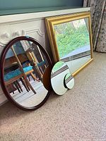 All four mirrors leaning against cabinet