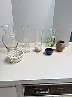 Group shot of all nine vases and bowls