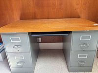 Front view showing entire desk, four drawers, keyboard tray