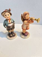 Front view of both figurines