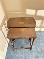 Both nesting tables stacked together showing overall design and turned legs