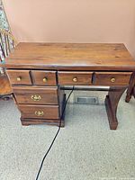 Front full view of desk showing all drawers and hardware