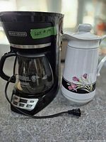 Coffee maker and thermal carafe side by side