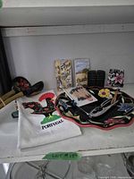 Lot overview showing plate, towel, plaques, spoons, nutcracker, toothpicks