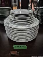 Stacks of dinner, salad and bread plates in Diane pattern