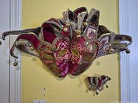 Overall view of double-face wall mask and miniature mask on wall