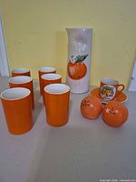 Full set showing six tumblers, pitcher, cup with saucer, and salt & pepper shakers