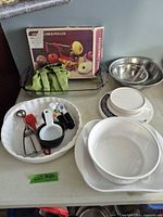 Group shot of kitchen tools including scale, bakeware, utensils
