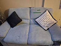 Front view of loveseat with two pillows