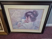 Mother holding infant print in dark wood frame with cream mat