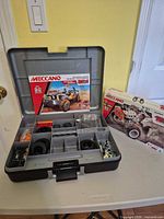 Open storage case showing Off-Road Truck 27-in-1 set components