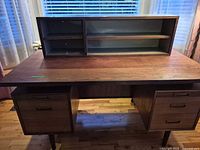 Front view of walnut desk with hutch installed
