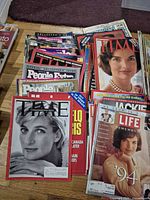 Stacks of assorted magazines showing Time, Life, People and others