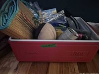 Overall view of red Coleman cooler and contents