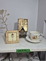 All five items grouped: frame, lantern, cup, saucer, bird decor