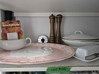 Shelf view showing platter, mills, timer, covered dish, butter dish