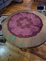 Top view of round wooden coffee table with glass center