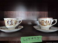 Both teacup and saucer sets displayed on shelf