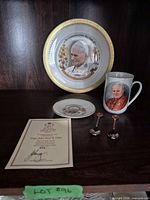 Group shot showing plate, mug, saucer, spoons and certificate