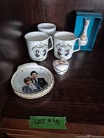 All six commemorative items displayed on shelf