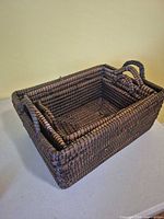Three wicker baskets nested together